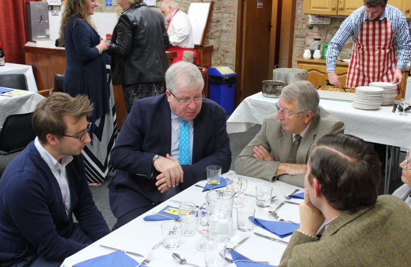 Sir Patrick speaking with guests