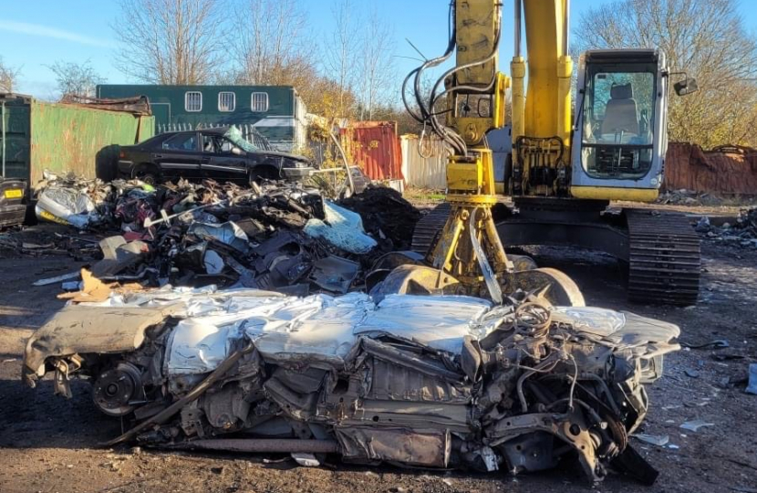 Car being crushed due to fly tipping